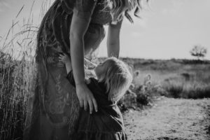 women lifting up a child