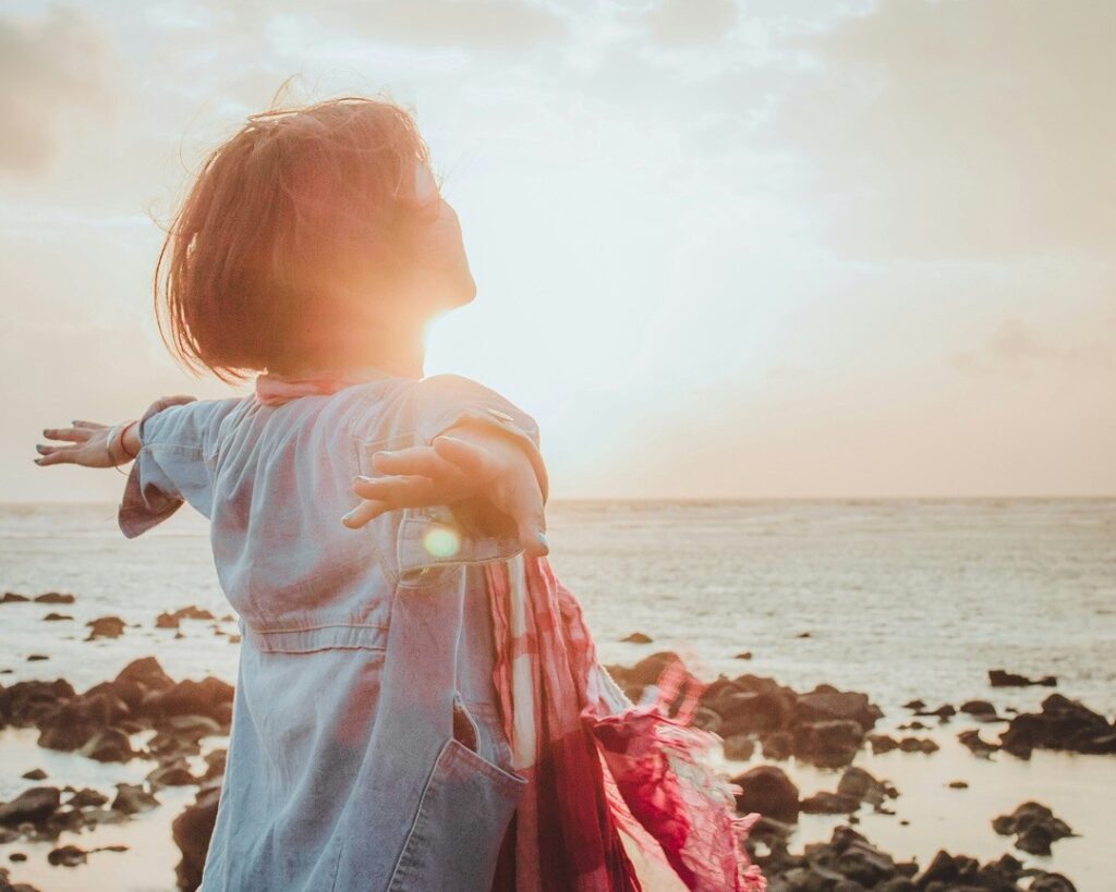 setting intentions to create a life you love. woman on beach